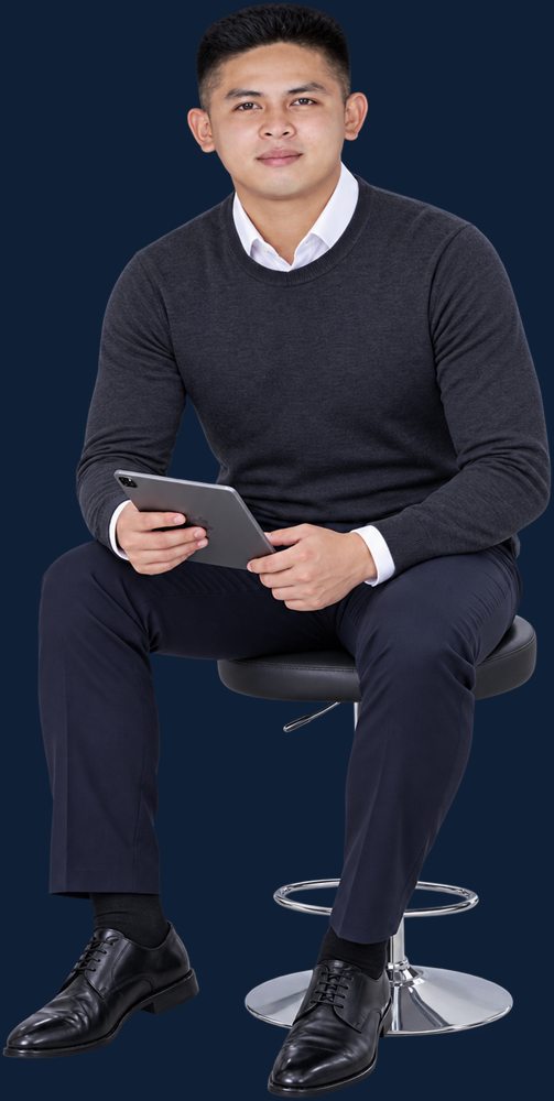 Diether Valeroso seated with a tablet, reviewing case notes