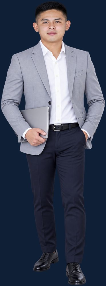 Diether Valeroso in a grey blazer holding a laptop